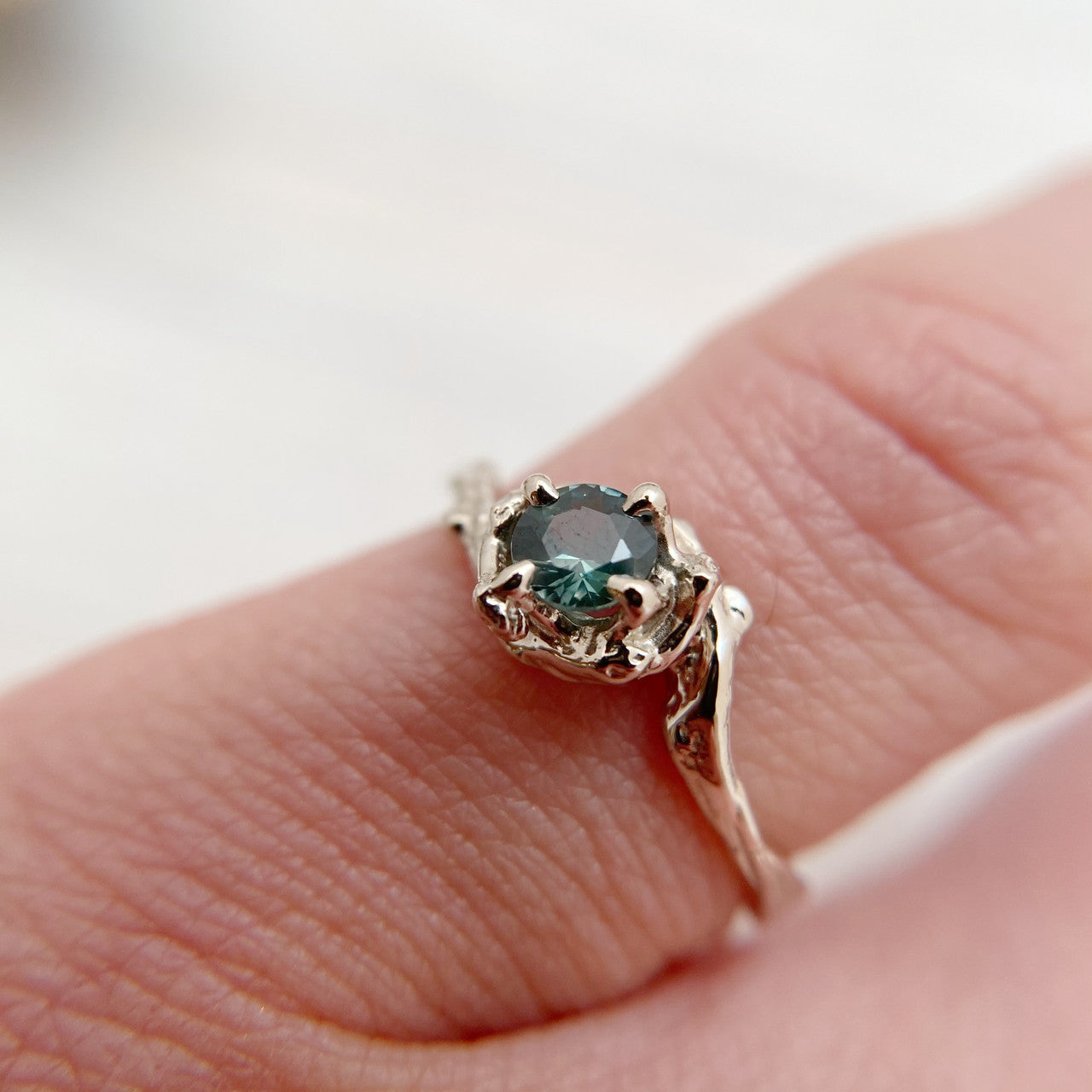 White gold green sapphire engagement ring by Olivia Ewing Jewelry